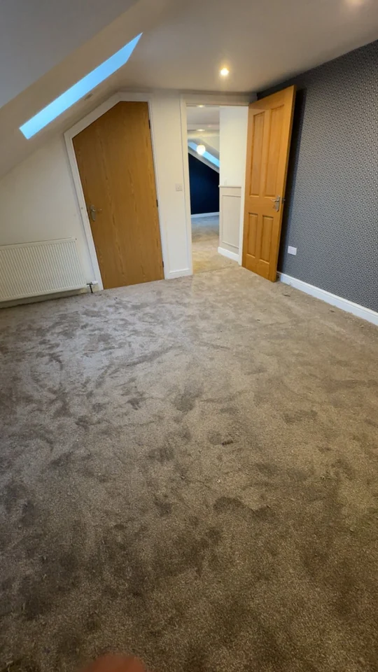 Plush grey carpet fitted in a finished room