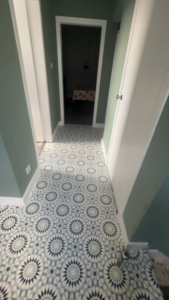 Patterned flooring professionally fitted along a hallway