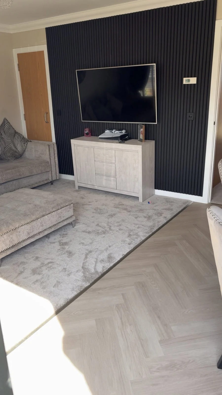 Carpet and vinyl flooring coordinated in a modern living room